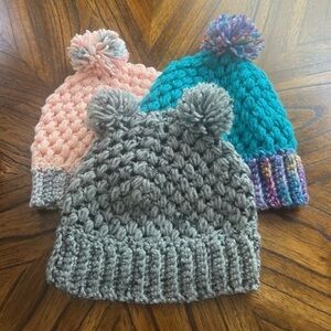 Gray and Pink Knit Hats with Playful Pom-Poms